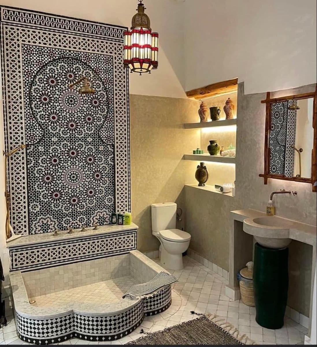 a bathroom with an ornate tile shower and sink, classique, zellige