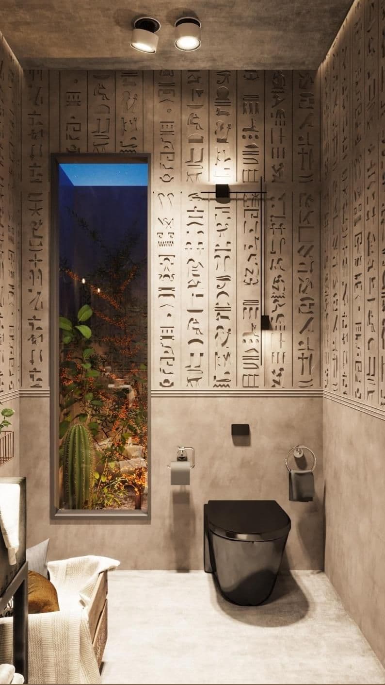 a bathroom with egyptian writing on the walls and a toilet in the middle, next to a window, classique, tadelakt