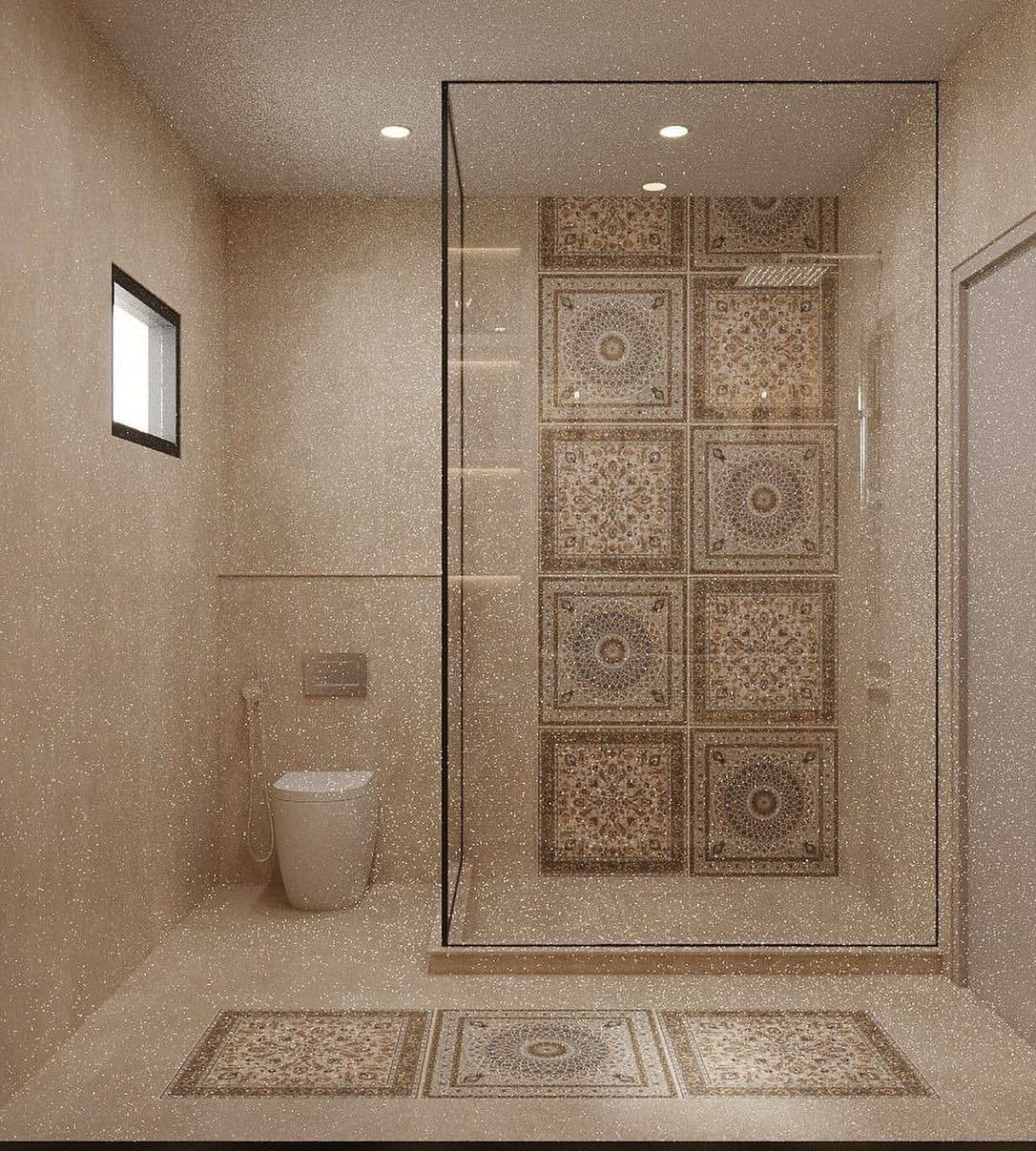 a bathroom with a glass shower door, toilet and tiled flooring on the walls, classique, zellige
