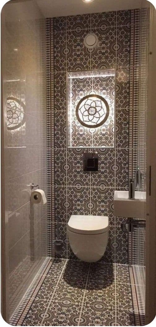 a bathroom with a toilet, sink and shower stall is shown in this image taken from the doorway, classique, tadelakt