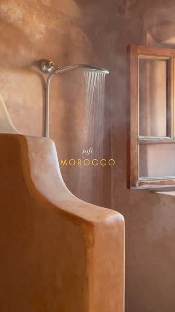 a bathroom with a shower head and window, classique, tadelakt