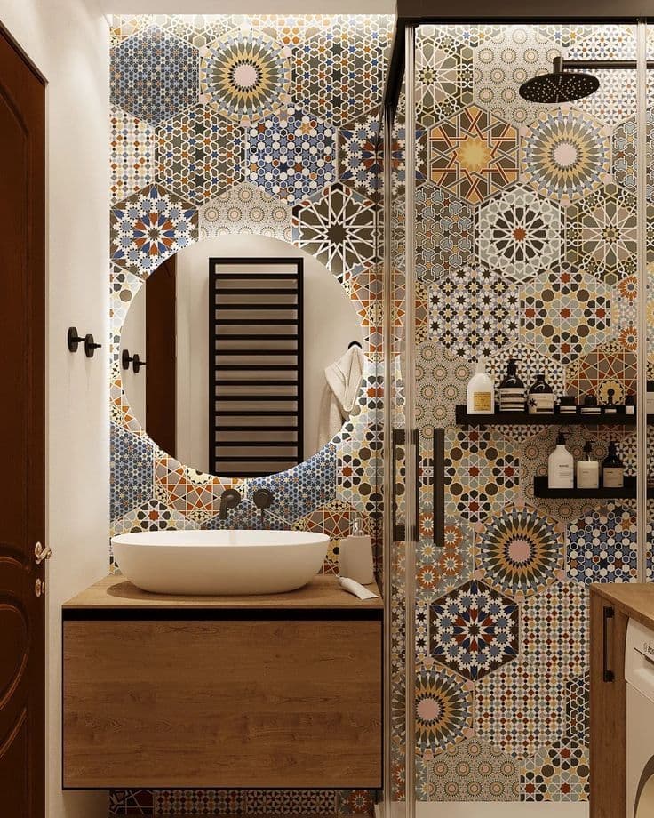 a bathroom with a sink, mirror and tiled wall in the shower area is shown, classique, zellige